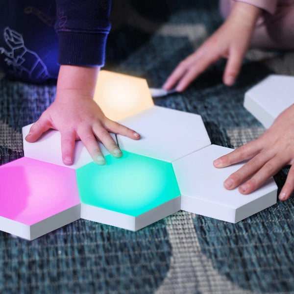 Parents and kids designing patterns with LED HEXlights