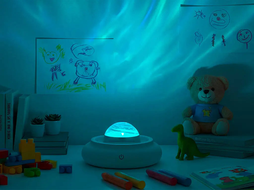 Galaxy projector creating calming blue light in a child's sensory-friendly bedroom