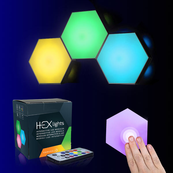 The image shows a 3-pack of HEXlights modular touch-controlled LED lights. The packaging displays the product name and the idea of a touch-sensitive surface- HEXlights-Touch-3-pack_1
